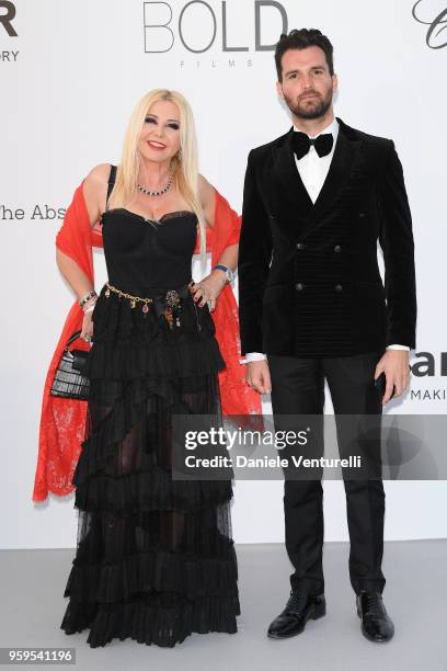 Monika Bacardi and Andrea Iervolino arrive at the amfAR Gala Cannes 2018 at Hotel du Cap-Eden-Roc on May 17, 2018 in Cap d'Antibes, France.