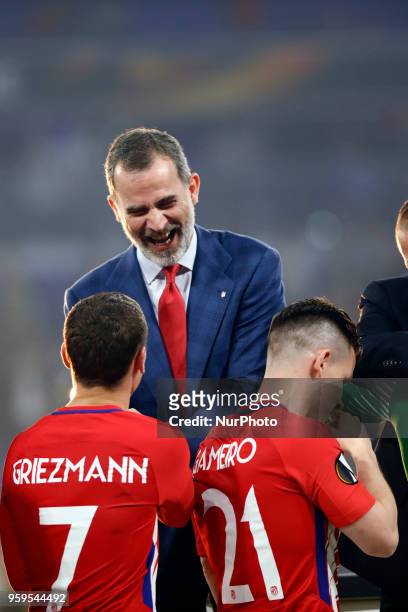 Spain's King Felipe VI congratulates Madrid's Antoine Griezmann and Kevin Gameiro after winningthe UEFA Europa League Final between Olympique de...