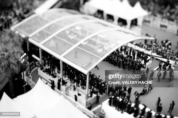 Photo taken with a tilt and shift lens shows models and guests arriving on May 15, 2018 for the screening of the film "Solo : A Star Wars Story" at...