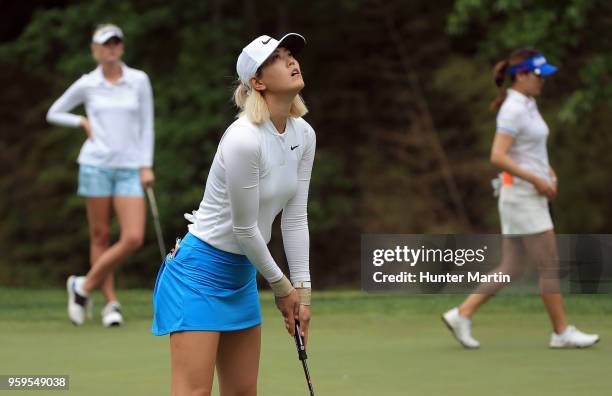 Michelle Wie reacts after missing her birdie putt on the fourth hole during the first round of the Kingsmill Championship presented by Geico on the...