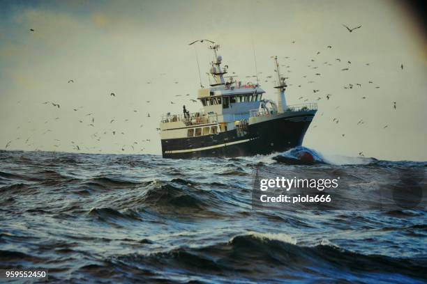 fishingboat vessel fishing in a rough sea - fishnet stock pictures, royalty-free photos & images