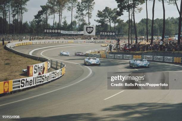 View of the Equipe Matra-Simca Shell Matra-Simca MS670 racing car driven by Henri Pescarolo of France and Graham Hill of Great Britain leading team...