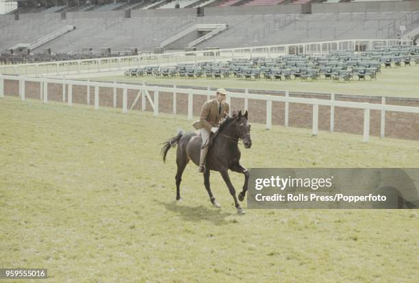 Prince Edward, Duke of Kent rides a horse in a race involving members of the British royal family during Royal Ascot race meeting at Ascot racecourse...