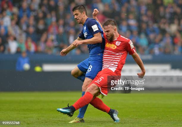 Anthony Losilla of Bochum and Benedikt Gimber of Regensburg battle for the ball during the second Bundesliga match between VfL Bochum 1848 and SSV...