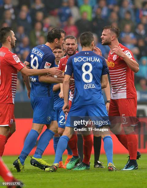 Patrick Fabian of Bochum speaks with Benedikt Gimber of Regensburg during the second Bundesliga match between VfL Bochum 1848 and SSV Jahn Regensburg...