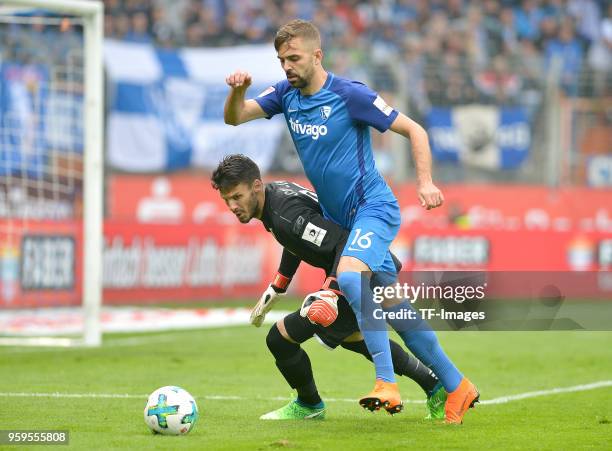 GoalkeeperAndre Weis of Regensburg and Lukas Hinterseer of Bochum battle for the ball during the second Bundesliga match between VfL Bochum 1848 and...