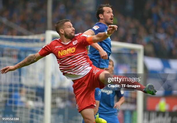 Marco Gruettner of Regensburg and Patrick Fabian of Bochum battle for the ball during the second Bundesliga match between VfL Bochum 1848 and SSV...