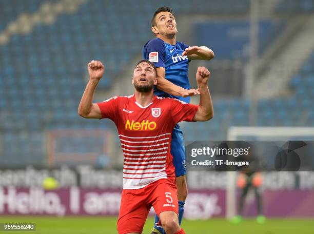 Benedikt Gimber of Regensburg and Anthony Losilla of Bochum battle for the ball during the second Bundesliga match between VfL Bochum 1848 and SSV...