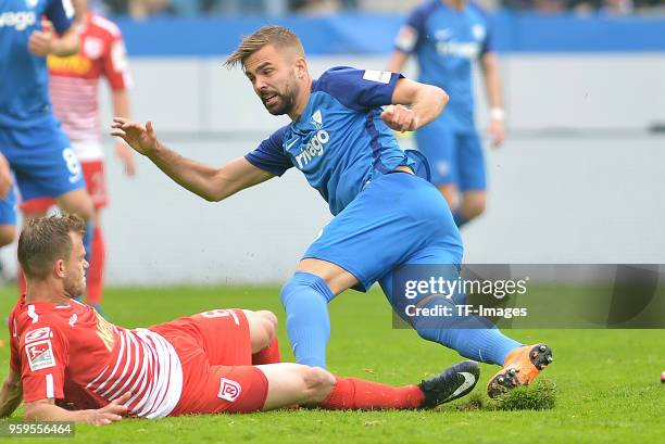 Benedikt Saller of Regensburg and Lukas Hinterseer of Bochum battle for the ball during the second Bundesliga match between VfL Bochum 1848 and SSV...