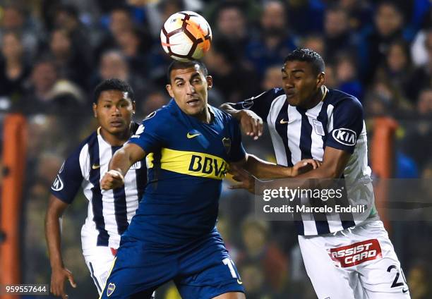 Ramon Abila of Boca Juniors fights for the ball with Aldair Fuentes of Alianza Lima during a match between Boca Juniors and Alianza Lima at Alberto...