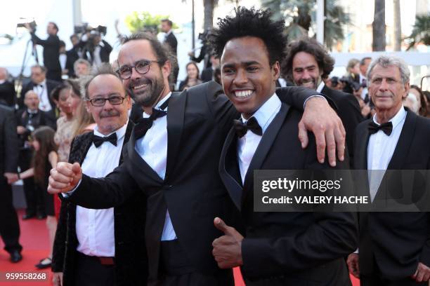 French director Michel Toesca and French farmer and member ot the migrants rights association "Roya citoyenne" Cedric Herrou arrive on May 17, 2018...