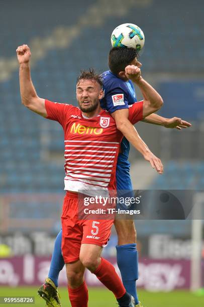 Benedikt Gimber of Regensburg and Anthony Losilla of Bochum battle for the ball during the second Bundesliga match between VfL Bochum 1848 and SSV...