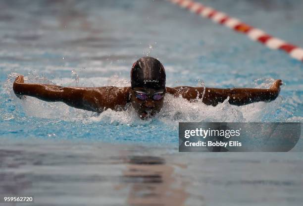 Simone Manuel races in the preliminary women's 100 meter butterfly race during the TYR Pro Swim Series at Indiana University Natatorium on May 17,...