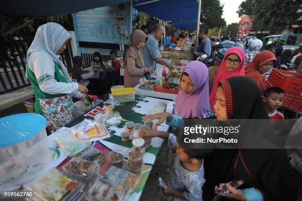 Ahead of the breaking fast, Muslims in Kupang come to the culinary market on the sidewalk to break the fast in Ramadan, Kupang, Indonesia, on May...