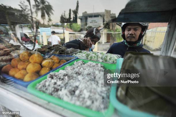 Ahead of the breaking fast, Muslims in Kupang come to the culinary market on the sidewalk to break the fast in Ramadan, Kupang, Indonesia, on May...