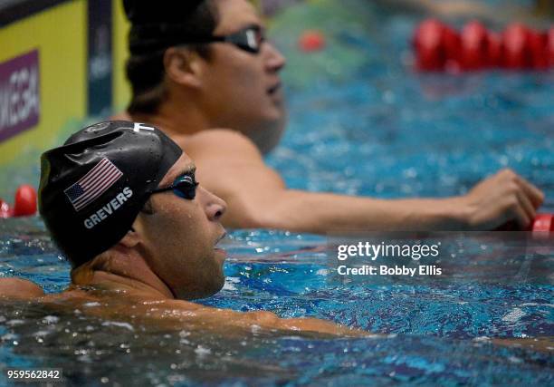 Matt Grevers looks at the scoreboard following the men's 100 meter freestyle preliminary race during the TYR Pro Swim Series at Indiana University...