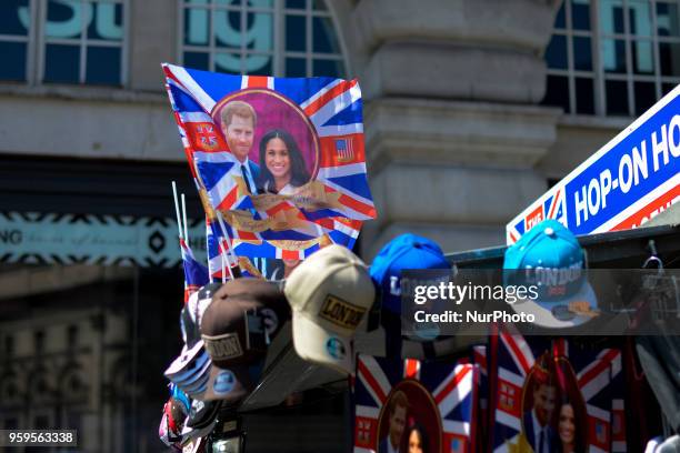 Souvenirs featuring Britain's Prince Harry and his fiance US actress Meghan Markle in a gift shop in Central London, on May 17, 2018. St George's...