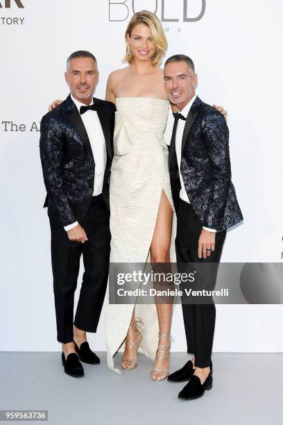 Hailey Clauson and Dean and Dan Caten arrive at the amfAR Gala Cannes 2018 at Hotel du Cap-Eden-Roc on May 17, 2018 in Cap d'Antibes, France.