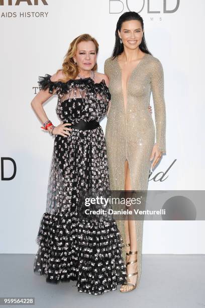 Caroline Scheufele and Adriana Lima arrive at the amfAR Gala Cannes 2018 at Hotel du Cap-Eden-Roc on May 17, 2018 in Cap d'Antibes, France.