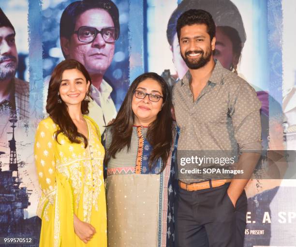 Indian film actress Alia Bhatt, director Meghna Gulzar and actor Vicky Kaushal pose for a picture during the success party of film Raazi at hotel Taj...