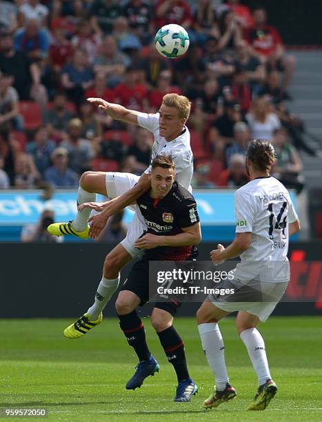 Timo Huebers of Hannover, Dominik Kohr of Leverkusen and Martin Harnik of Hannover battle for the ball during the Bundesliga match between Bayer 04...