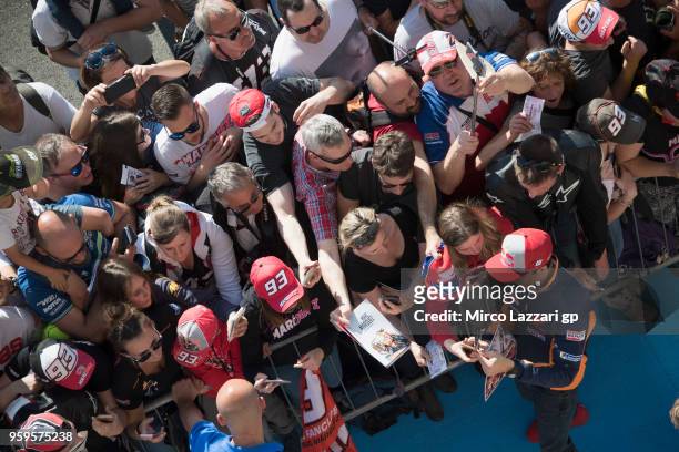 Marc Marquez of Spain and Repsol Honda Team signs autographs for fans in pit during the MotoGp of France - Previews on May 17, 2018 in Le Mans,...