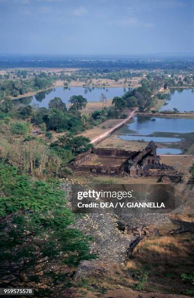 Ruins of the Khmer temple of Vat Phou , rice fields in the background, Champasak, Laos.