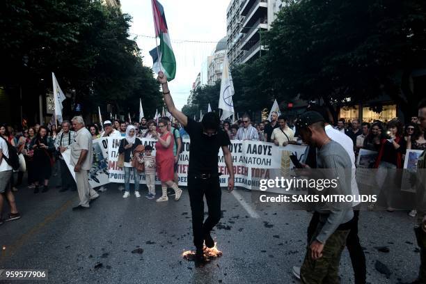 Protesters shout slogans in front of the US consulate during a demonstration on May 17 to denounce the bloodshed along the Gaza border and the...
