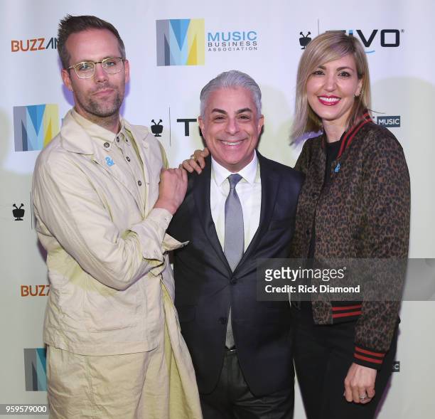 Artists Justin Tranter, President of Music Business Association, James Donio and manager Beka Tischker take photos before the Music Biz 2018 Awards...