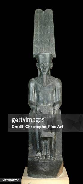 The god amon protecting toutankhamon, new empire, Egyptian Art, Louvre Museum, Egypt.