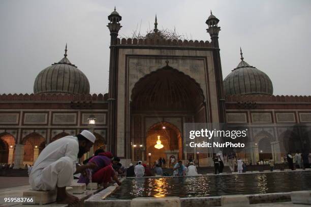 Muslims perform ablution while preparing to break her fast at mosque Jamia Masjid during the first day of Ramadan, in Delhi, India on 17 May 2018.