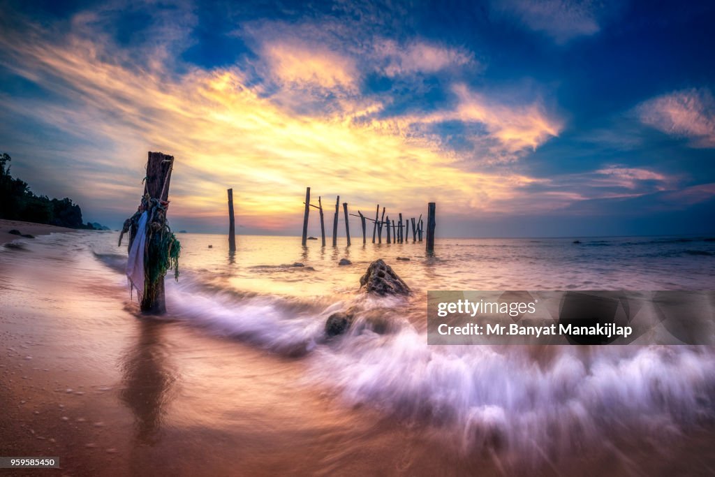 Seascape with wood bridge During Sunrise