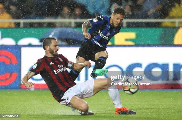 Alejandro Dario Gomez of Atalanta BC is challenged by Leonardo Bonucci of AC Milan during the serie A match between Atalanta BC and AC Milan at...