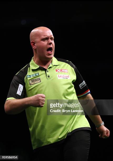 Michael van Gerwen of The Netherlands celebrates beating Rob Cross of Great Britain in their semi-final at the Betway Premier League Darts Play-Offs...