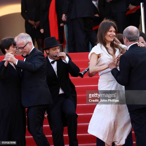 Cannes Film Festival Director Thierry Fremaux and Cannes Film Festival President Pierre Lescure dances as musicians play on the red carpet before the...