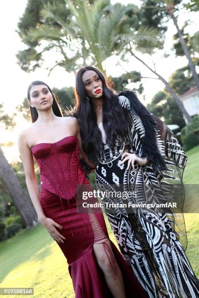 Neelam Gill and Winnie Harlow attend the cocktail at the amfAR Gala Cannes 2018 at Hotel du Cap-Eden-Roc on May 17, 2018 in Cap d'Antibes, France.
