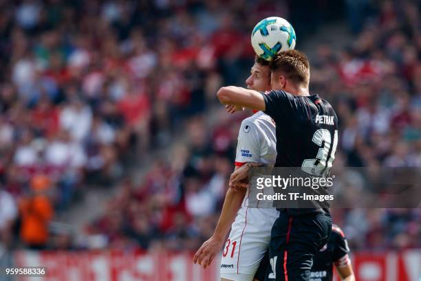 Marcel Sobottka of Duesseldorf and Ondrej Petrak of Nuernberg battle for the ball during the Second Bundesliga match between 1. FC Nuernberg and...