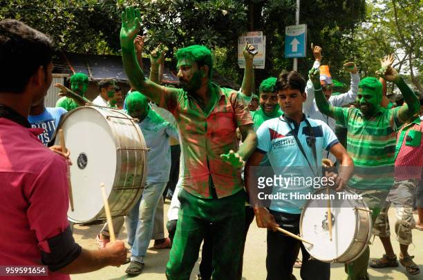 Supporters of Trinamool Congress smeared in green colour celebrate their victory of South 24 Parganas district in Panchayat elections in front of...