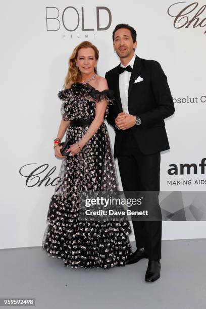 Adrien Brody and Caroline Scheufele arrive at the amfAR Gala Cannes 2018 at Hotel du Cap-Eden-Roc on May 17, 2018 in Cap d'Antibes, France.