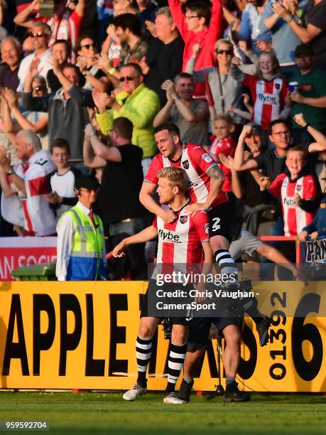 Exeter City's Jayden Stockley, left, celebrates scoring the opening goal with team-mate Pierce Sweeney during the Sky Bet League Two Play Off Semi...