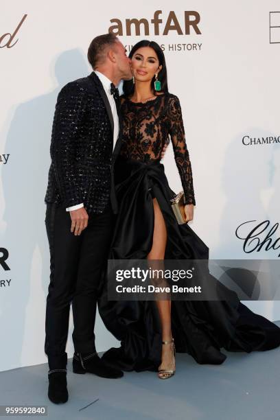 Philipp Plein and Morgan Osman arrive at the amfAR Gala Cannes 2018 at Hotel du Cap-Eden-Roc on May 17, 2018 in Cap d'Antibes, France.