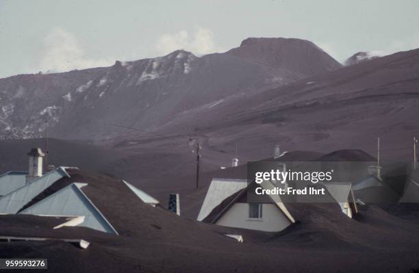 Volcano eruption on Heimaey Island in Iceland on 23 January 1973. Homes are buried in ashes.