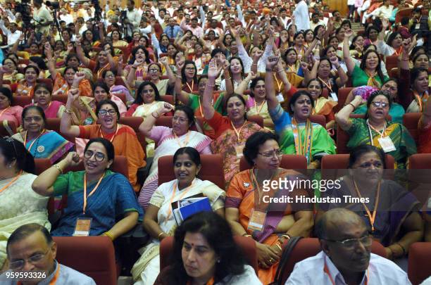Members of BJP listen to Prime Minister Narendra Modi during the concluding session of the National Executive Committee meeting of all frontal...