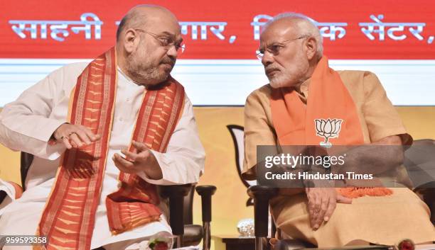 Prime Minister Narendra Modi with BJP National President Amit Shah during the concluding session of the National Executive Committee meeting of all...