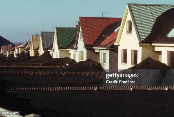 Volcano eruption on Heimaey Island in Iceland on 23 January 1973. Homes are buried in ashes.