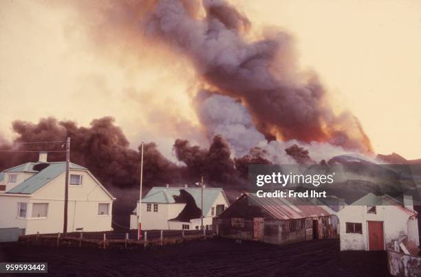 Volcano eruption on Heimaey Island in Iceland on 23 January 1973. Ashes and lava burying homes, barns and farmland.