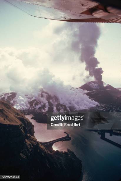 Volcano eruption on Heimaey Island in Iceland on 23 January 1973. It spew up ashes, stones and lava until July 1973. Aerial view of the island and...