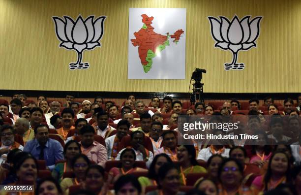 Members of BJP listen to Prime Minister Narendra Modi during the concluding session of the National Executive Committee meeting of all frontal...