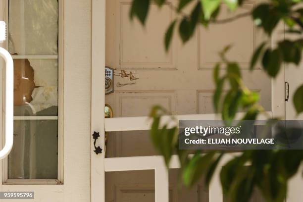 Scratches are seen by the lock on the front door of the home where ten children were allegedly tortured and abused on May 17 in Fairfield,...