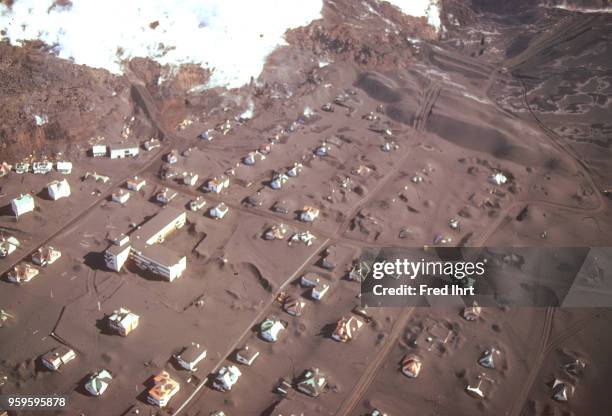 Volcano eruption on Heimaey Island in Iceland on 23 January 1973. Aerial view of the city of Vestmannaeyjar buried in lava and ashes.